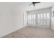 Bright and spacious bedroom with plush carpet, a ceiling fan, and bright windows at 1605 Ridenour Nw Pkwy, Kennesaw, GA 30152