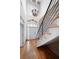 Elegant foyer with a grand staircase, chandelier, and beautiful hardwood floors at 1605 Ridenour Nw Pkwy, Kennesaw, GA 30152
