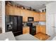 Well-equipped kitchen with stainless steel appliances, wood cabinets, and ample counter space at 1605 Ridenour Nw Pkwy, Kennesaw, GA 30152