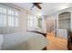 Comfortable bedroom boasts an exposed brick wall, built-in bookshelves, and hardwood floors at 1605 Ridenour Nw Pkwy, Kennesaw, GA 30152