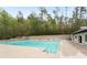 Community pool with ample deck space, surrounded by mature trees at 1605 Ridenour Nw Pkwy, Kennesaw, GA 30152