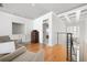 Upstairs sitting area with hardwood floors and view of foyer at 1605 Ridenour Nw Pkwy, Kennesaw, GA 30152
