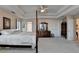 Spacious main bedroom features tray ceiling, four-poster bed, and neutral decor at 2095 Tribble Walk Dr, Lawrenceville, GA 30045