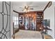 Cozy bedroom featuring built-in bookcases, ceiling fan, and decorative curtain at 3435 Kingsboro Ne Rd # 1701, Atlanta, GA 30326