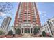 Striking exterior showcasing an upscale high-rise building with elegant architecture, manicured landscaping, and inviting entrance at 3435 Kingsboro Ne Rd # 1701, Atlanta, GA 30326