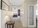 Hallway leading to the main bedroom with a decorative glass door and table lamp at 3435 Kingsboro Ne Rd # 1701, Atlanta, GA 30326