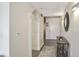 Hallway with decorative mirror, rug, entry door, and archway offers a welcoming feel at 3435 Kingsboro Ne Rd # 1701, Atlanta, GA 30326