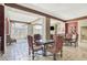 This living room features tile flooring and plenty of natural light from the large windows and access to the balcony at 3435 Kingsboro Ne Rd # 1701, Atlanta, GA 30326