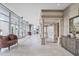 Lobby features a vintage style lounge with lots of natural light and classic architectural columns at 3435 Kingsboro Ne Rd # 1701, Atlanta, GA 30326
