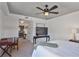 Comfortable main bedroom with ceiling fan, leading to the ensuite bathroom at 3435 Kingsboro Ne Rd # 1701, Atlanta, GA 30326