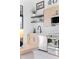 Bright modern kitchen featuring stainless steel appliances, black faucet and floating shelving at 567 Ponce De Leon Ne Ave # 317, Atlanta, GA 30308