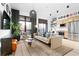 Inviting living room with hardwood floors, modern decor, and abundant natural light from large windows at 567 Ponce De Leon Ne Ave # 317, Atlanta, GA 30308