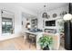Stylish living room with light hardwood floors, bar seating, and an open layout perfect for entertaining at 567 Ponce De Leon Ne Ave # 317, Atlanta, GA 30308