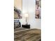 Bedroom featuring decorative lamp on top of a modern, ridged nightstand with brass hardware at 567 Ponce De Leon Ne Ave # 317, Atlanta, GA 30308