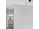 Hallway view to a bathroom featuring a vanity, mirror, and cabinets at 901 Echo Park Dr, Suwanee, GA 30024