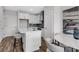 Modern kitchen with white cabinets, island seating, and stainless steel appliances at 901 Echo Park Dr, Suwanee, GA 30024