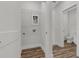 Bright laundry room featuring wood-look floors, white walls, and convenient washer and dryer hookups at 901 Echo Park Dr, Suwanee, GA 30024