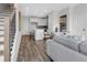 Open-concept living space with hardwood floors and seamless flow into the kitchen at 901 Echo Park Dr, Suwanee, GA 30024