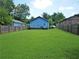 Expansive backyard with lush green grass, providing ample space for outdoor activities at 998 Sparks Sw St, Atlanta, GA 30310