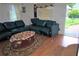 Cozy living room featuring hardwood floors and a comfortable seating area near a sunny window at 998 Sparks Sw St, Atlanta, GA 30310