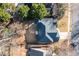 Birds eye view of home with a large patio, surrounded by mature trees, creating a private backyard space at 1224 Indian Hills Pkwy, Marietta, GA 30062