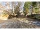 Spacious backyard with a stone patio and a grassy area, perfect for outdoor entertaining or relaxation at 1224 Indian Hills Pkwy, Marietta, GA 30062