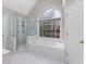 Main bathroom with large window, soaking tub and glass enclosed shower at 1224 Indian Hills Pkwy, Marietta, GA 30062