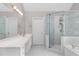 Bathroom featuring a glass shower, bathtub, white counters, and gold fixtures at 1224 Indian Hills Pkwy, Marietta, GA 30062