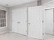 Bedroom with carpet, a window, and two closets at 1224 Indian Hills Pkwy, Marietta, GA 30062