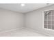 Neutral bedroom with carpet, a large window, and natural light at 1224 Indian Hills Pkwy, Marietta, GA 30062