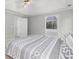 Bright bedroom features vaulted ceilings, a ceiling fan, and a view of the bathtub through an arched window at 1224 Indian Hills Pkwy, Marietta, GA 30062