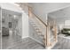 Bright entryway with staircase featuring wood and white trim and light gray floors at 1224 Indian Hills Pkwy, Marietta, GA 30062