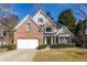 Charming two-story brick home with manicured landscaping and a two-car garage at 1224 Indian Hills Pkwy, Marietta, GA 30062