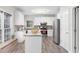 Bright kitchen with white cabinets, granite counters, stainless appliances and island at 1224 Indian Hills Pkwy, Marietta, GA 30062