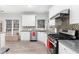 Modern kitchen with white cabinets, granite countertops, stainless steel appliances and tile backsplash at 1224 Indian Hills Pkwy, Marietta, GA 30062