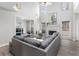 Spacious living room with a fireplace, large windows, and a comfortable grey sectional sofa at 1224 Indian Hills Pkwy, Marietta, GA 30062