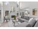 Spacious living room with fireplace, large windows, and comfortable seating at 1224 Indian Hills Pkwy, Marietta, GA 30062