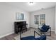 Cozy office with a piano, comfortable blue chairs, and ample natural light at 1224 Indian Hills Pkwy, Marietta, GA 30062