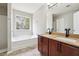Bright bathroom features double vanity, granite countertops, tub, and separate shower at 1241 To Lani Path, Stone Mountain, GA 30083