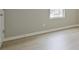 Bedroom with neutral walls, white trim, and light wood-look flooring at 1241 To Lani Path, Stone Mountain, GA 30083