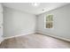 Inviting bedroom with a large window and light-colored flooring at 1241 To Lani Path, Stone Mountain, GA 30083