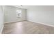 Bright bedroom with a large window, neutral walls, and stylish wood flooring at 1241 To Lani Path, Stone Mountain, GA 30083