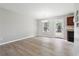 Bright dining area with stylish flooring, a modern chandelier, and a door to the backyard at 1241 To Lani Path, Stone Mountain, GA 30083