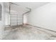 Spacious garage with concrete flooring and a white door at 1241 To Lani Path, Stone Mountain, GA 30083