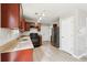 Bright kitchen features modern appliances, wooden cabinets, and light-toned flooring at 1241 To Lani Path, Stone Mountain, GA 30083