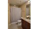 Bathroom features granite countertops, vanity sink, and shower with curtain at 361 17Th Nw St # 1021, Atlanta, GA 30363