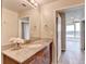 Bright bathroom with vanity, granite counters, and large mirror at 361 17Th Nw St # 1021, Atlanta, GA 30363