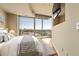 Bright bedroom boasts a large window with stunning city views and a wall-mounted television at 361 17Th Nw St # 1021, Atlanta, GA 30363