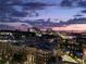 Scenic cityscape view at dusk, featuring illuminated buildings and a colorful sky at 361 17Th Nw St # 1021, Atlanta, GA 30363