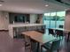 Well-lit dining area with multiple tables, bar seating, and contemporary design features at 361 17Th Nw St # 1021, Atlanta, GA 30363